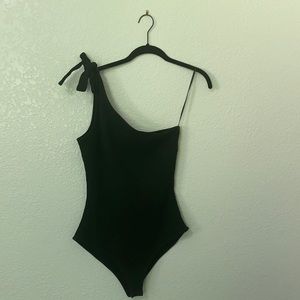 Black one shoulder body suit